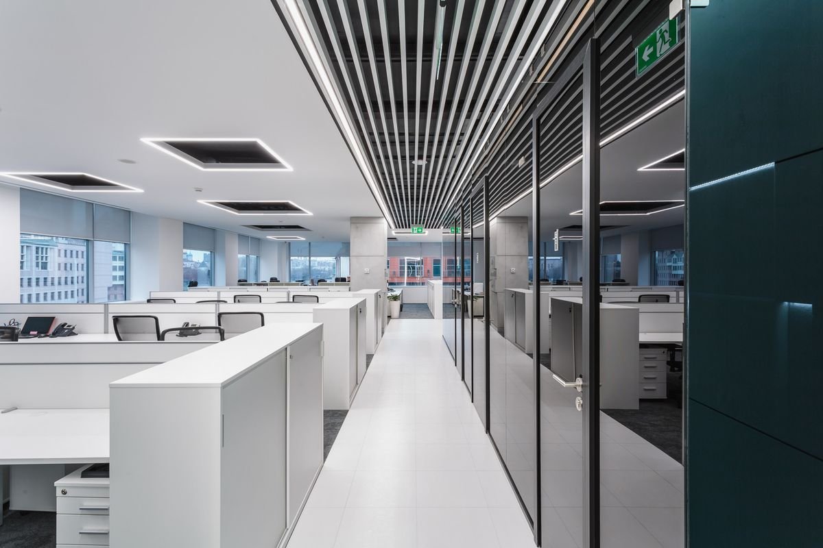 Contemporary office interior with modern workstations and natural lighting