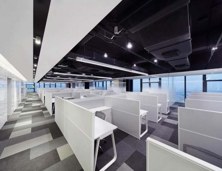 Modern office workstations with ergonomic desk layouts